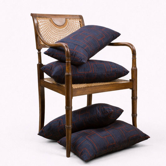 Wooden chair with plaid cushions on a white background