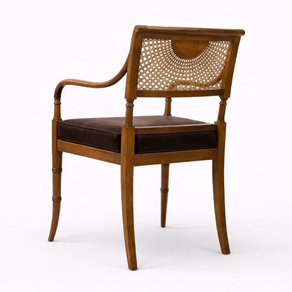 Wooden chair with woven backrest on a white background