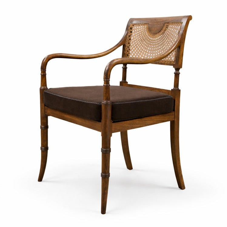 Wooden armchair with wicker backrest and brown cushion on a white background