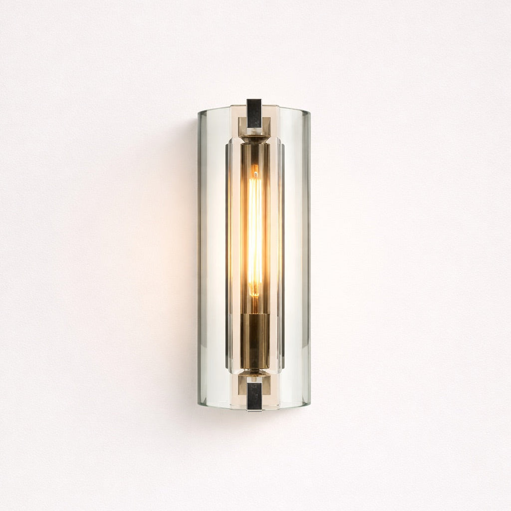 Wall-mounted light fixture with a cylindrical design on a white background
