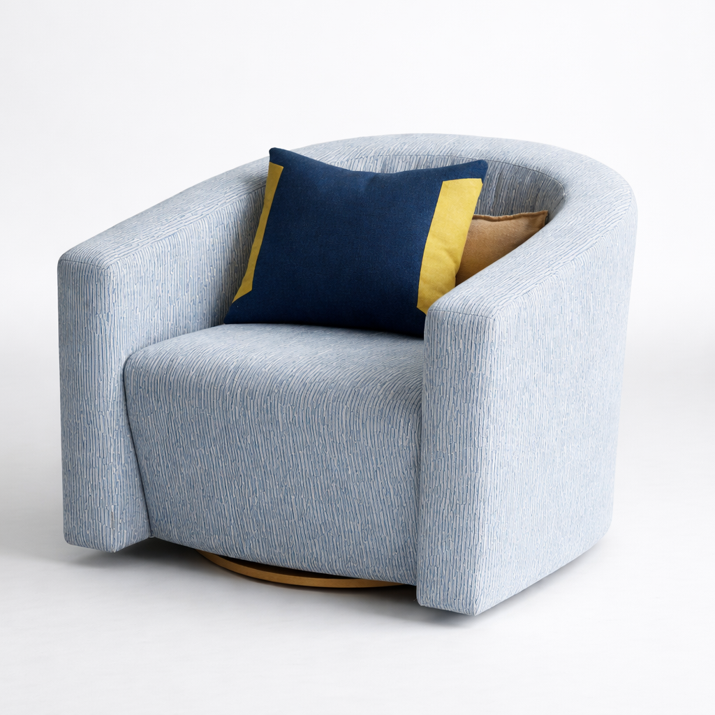 Gray armchair with a blue and yellow cushion on a white background
