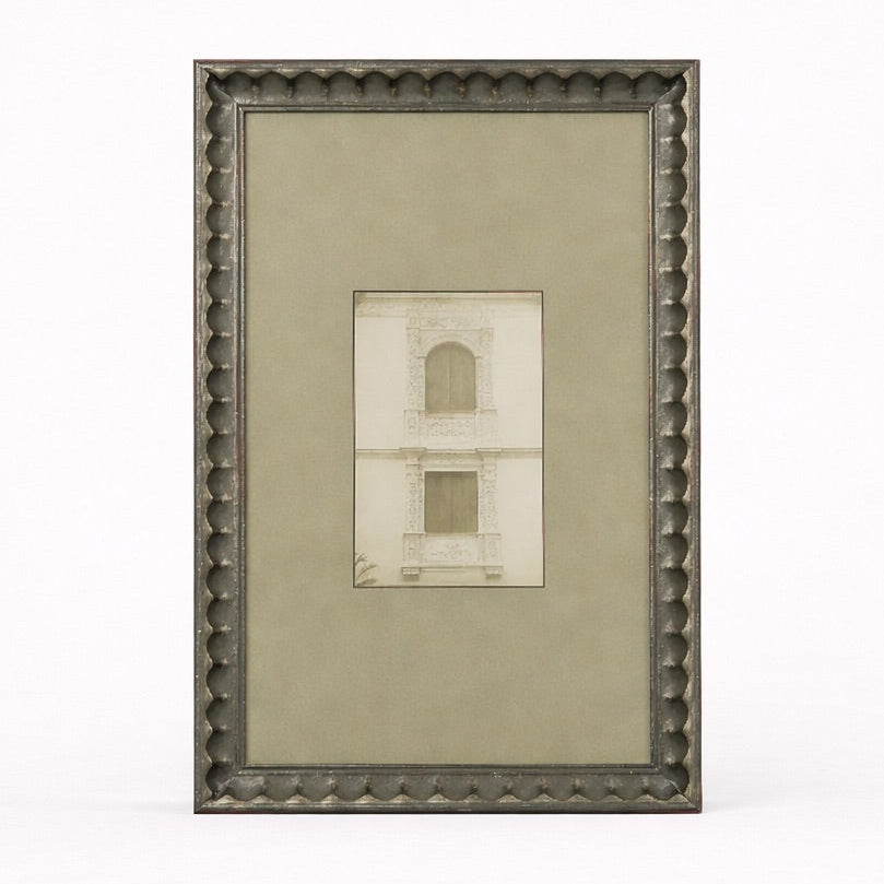 Framed artwork with a textured border on a white background