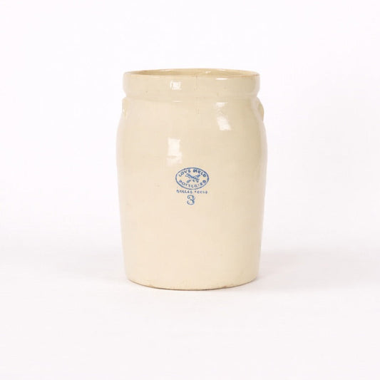 Cream-colored ceramic jar with a blue logo on a white background