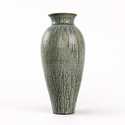 Decorative vase with textured surface on a white background