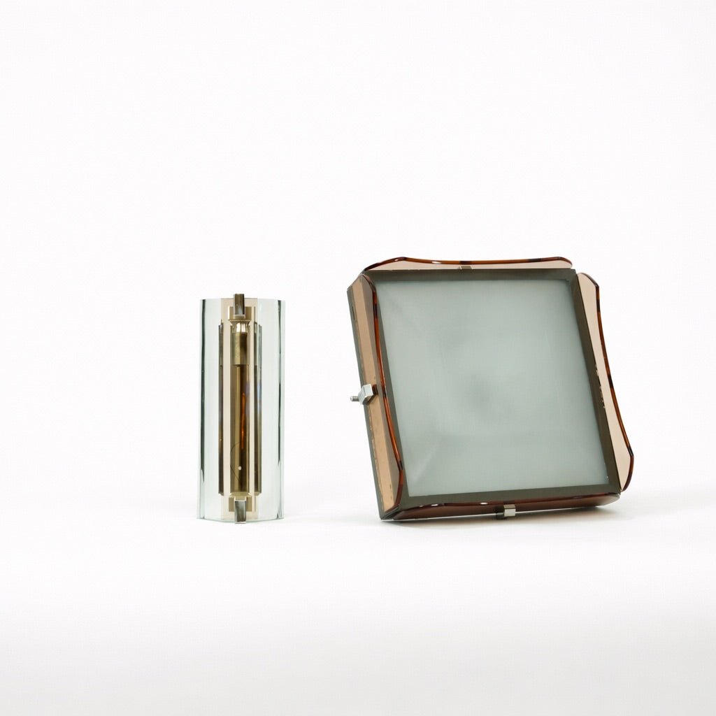 Two glass objects on a white background