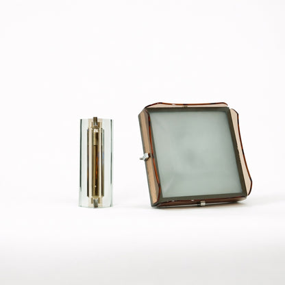 Two glass objects on a white background