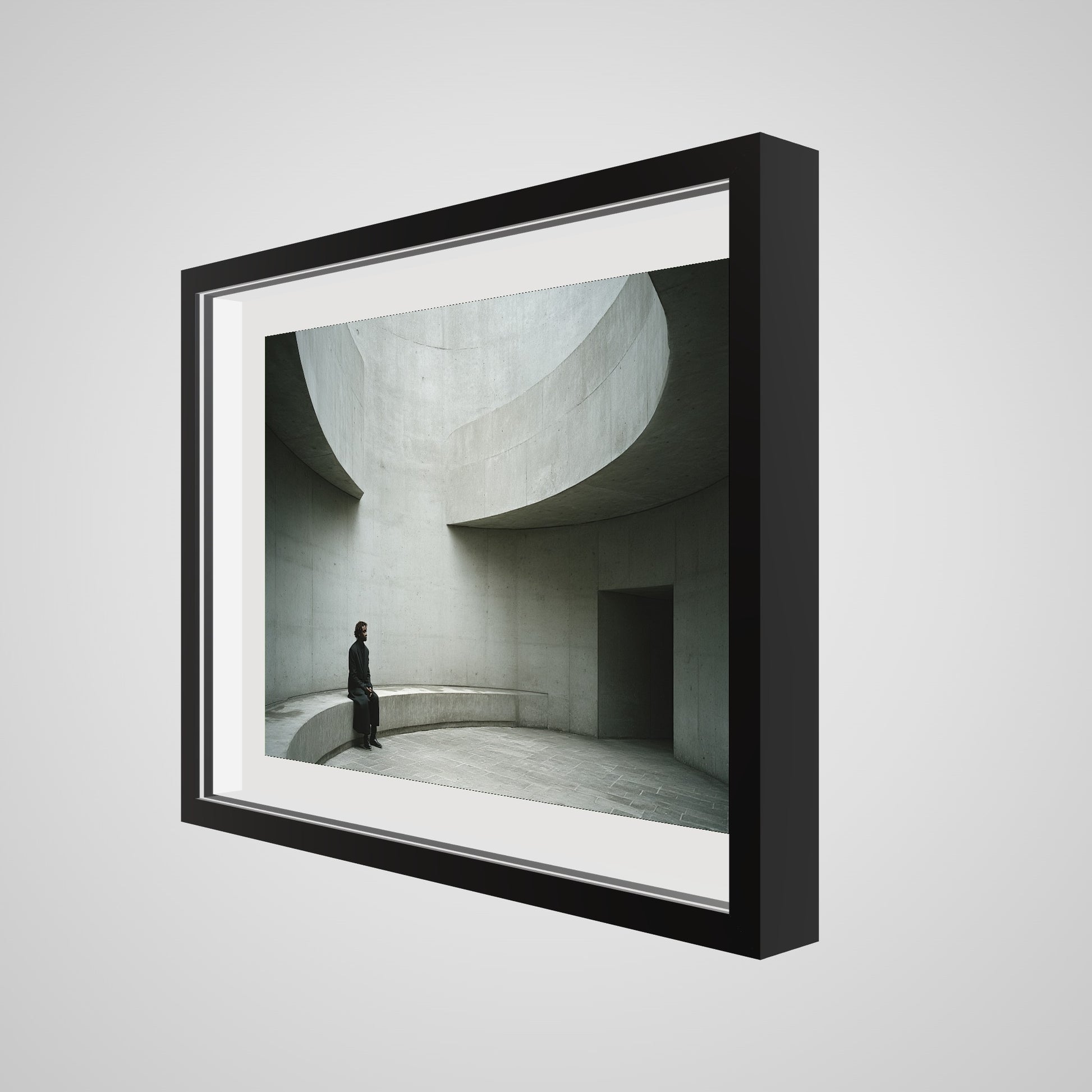 Angled detail view of Solitary Figure on Concrete Bench print in a 24x18 deep black spacer frame