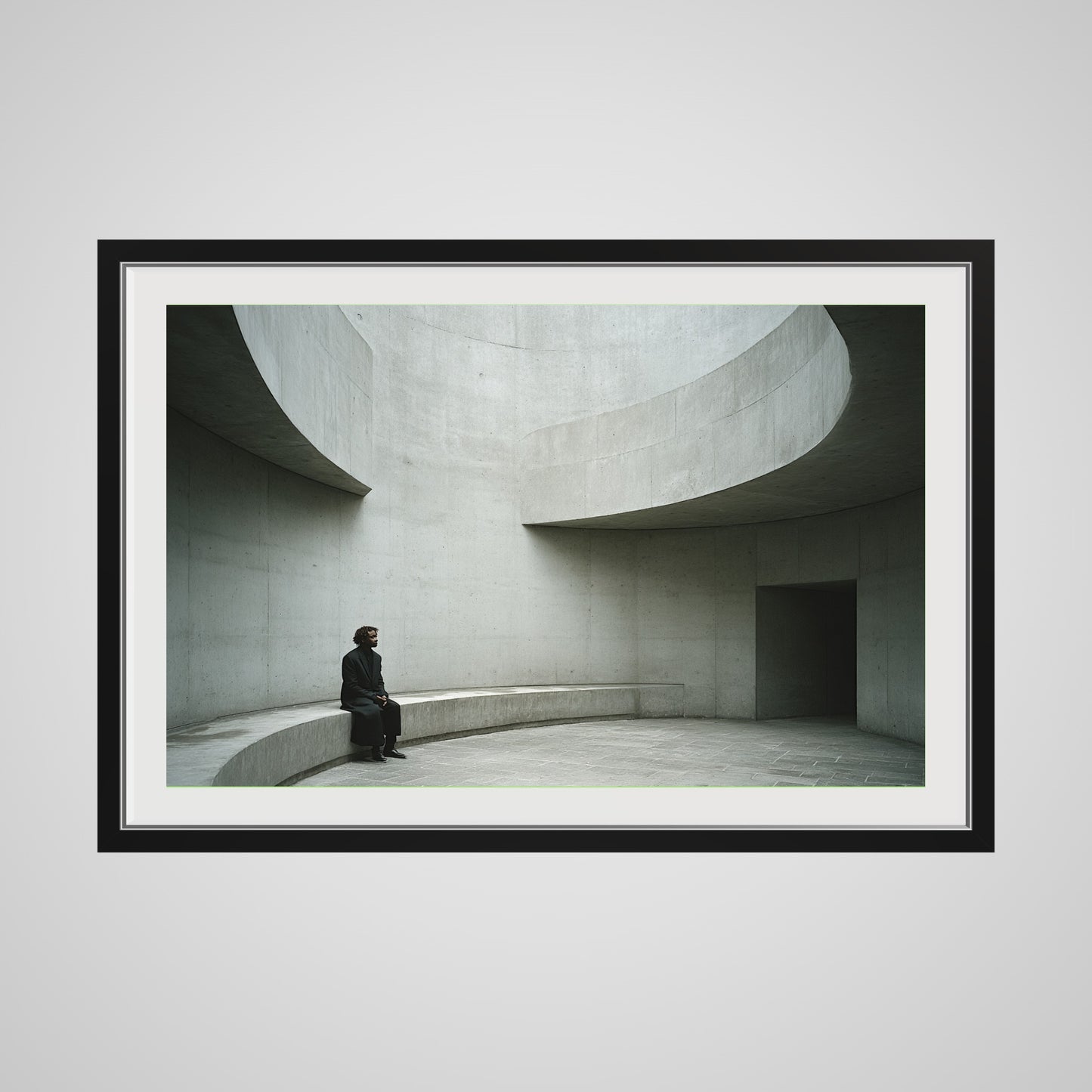 Front view of Solitary Figure on Concrete Bench print in a 36x24 deep black spacer frame