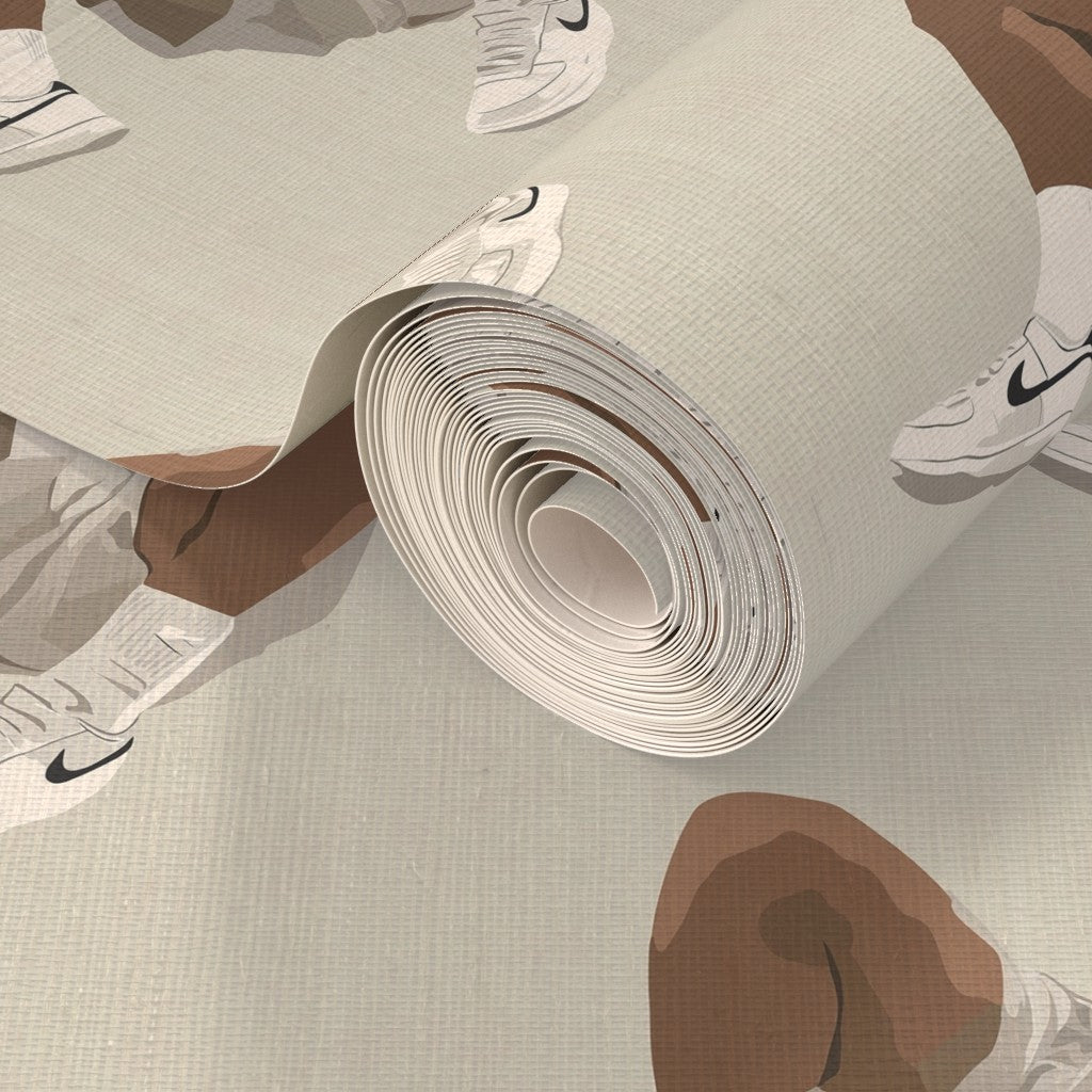 A roll of White Kicks wallpaper printed on woven natural fiber grasscloth substrate.