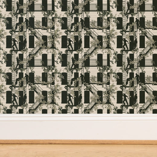 Close-up showing the tactile fiber variations of White grass cloth street scene wallpaper.