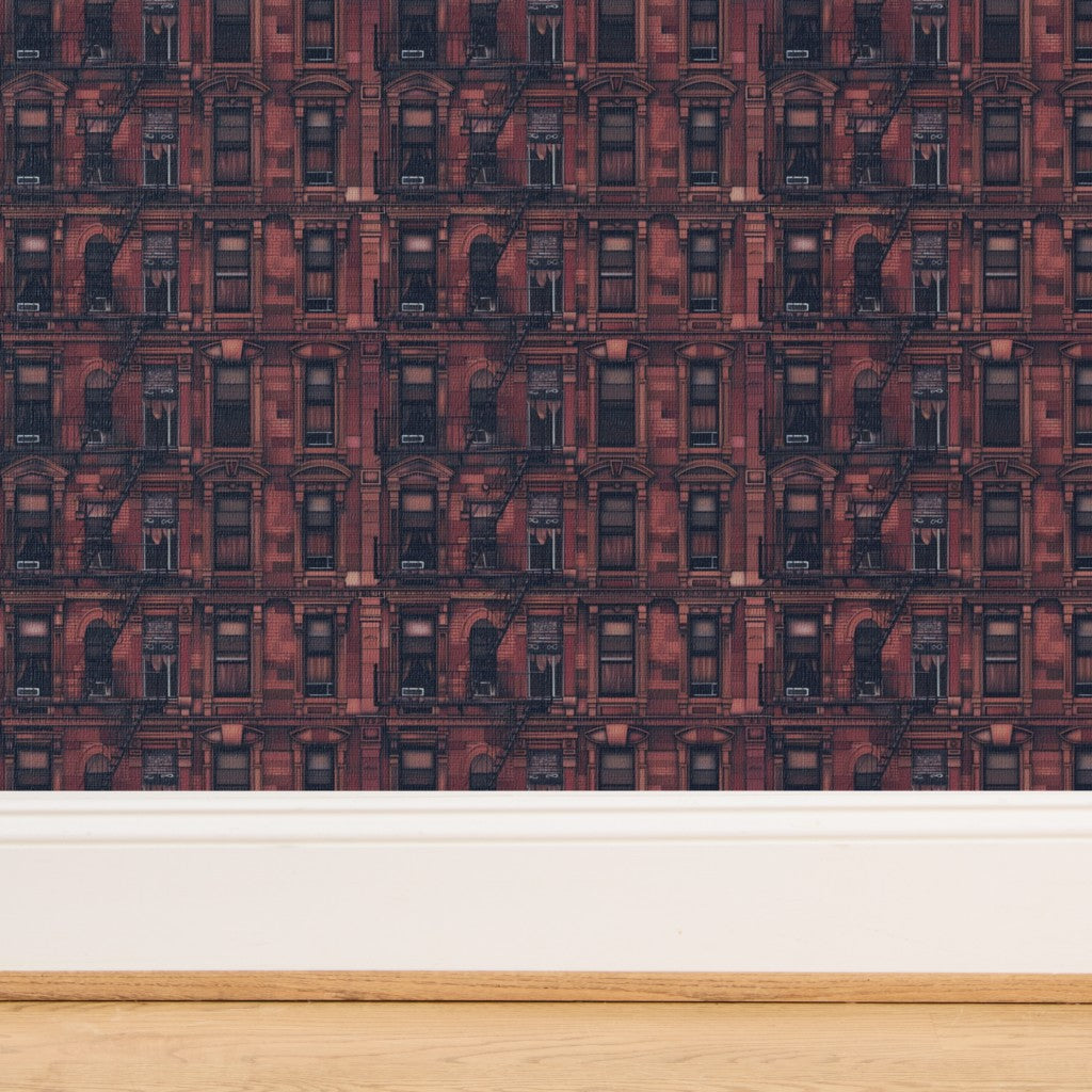 Close-up of Waverly Place oxblood red grasscloth wallpaper with organic woven texture