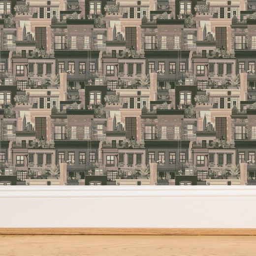 Close-up detail of the woven grass cloth texture of the Beige West Village Rooftops wallpaper.