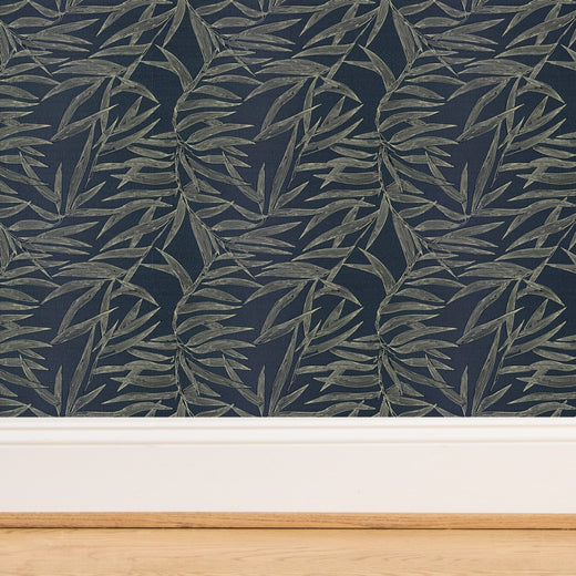 Close-up of the natural woven grasscloth substrate featuring the bamboo leaf design.