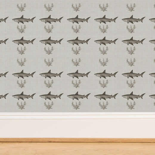Close-up perspective of the woven natural fibers on the grasscloth Solo Swimmer wallpaper.