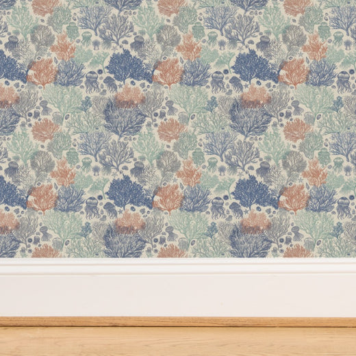 Close-up of the organic woven grasscloth backing on Sun Bleached Jelly Reef wallpaper.