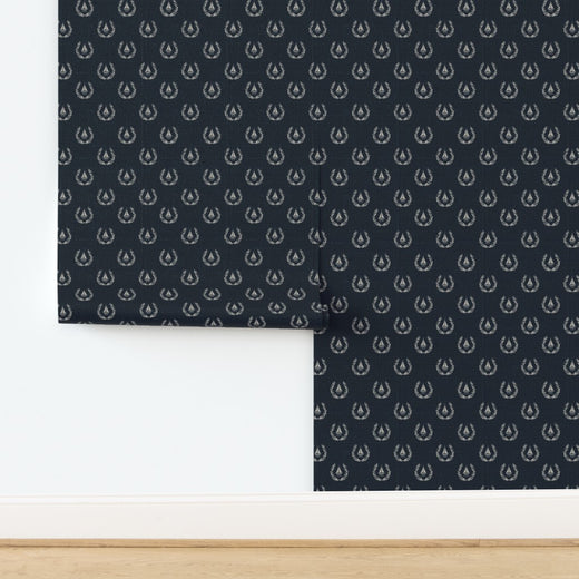 Sailing Crest nautical motif printed on textured, woven natural fiber grasscloth wallpaper.