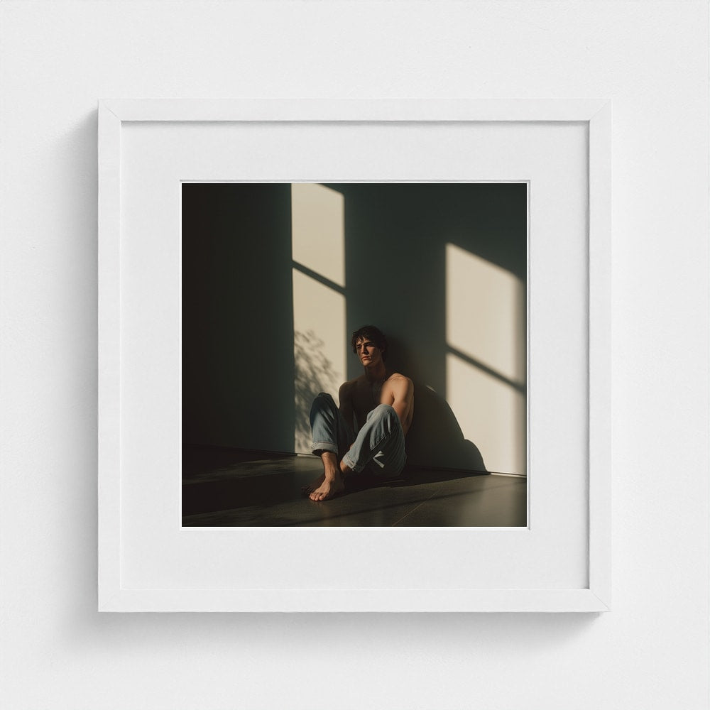 A 16x16 square figurative art print in a clean white frame, featuring a contemplative male portrait.