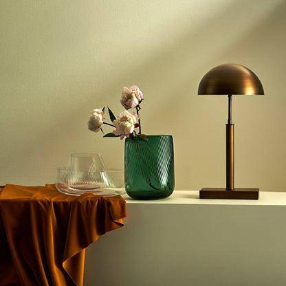 Modern interior setting featuring the NUDE Glass Opti vase collection on a minimalist shelf