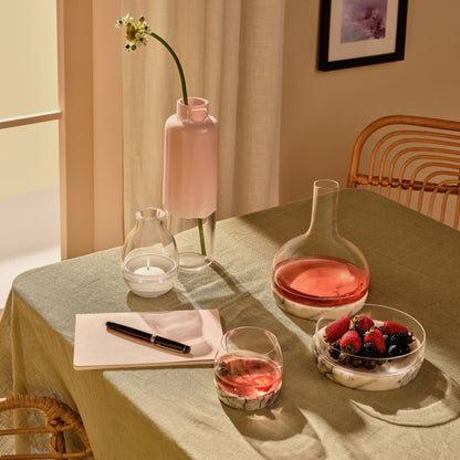 Vase, carafe, and large Chill bowl on a marble base set against a neutral backdrop