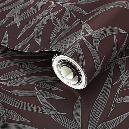 Subtle reflection on the metallic Fawn botanical bamboo wallpaper.