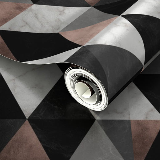 Close-up of the metallic finish on the pink and black geometric marble tile pattern, showing luminous reflections.