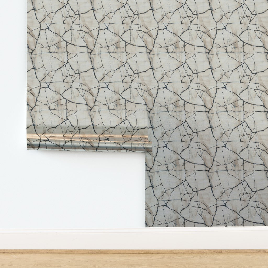 Detail of the metallic pearlescent finish on the Crackled Porcelain wallpaper under soft light.