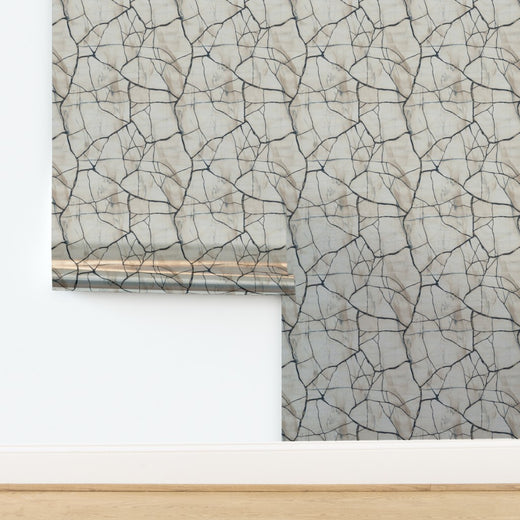 Detail of the metallic pearlescent finish on the Crackled Porcelain wallpaper under soft light.