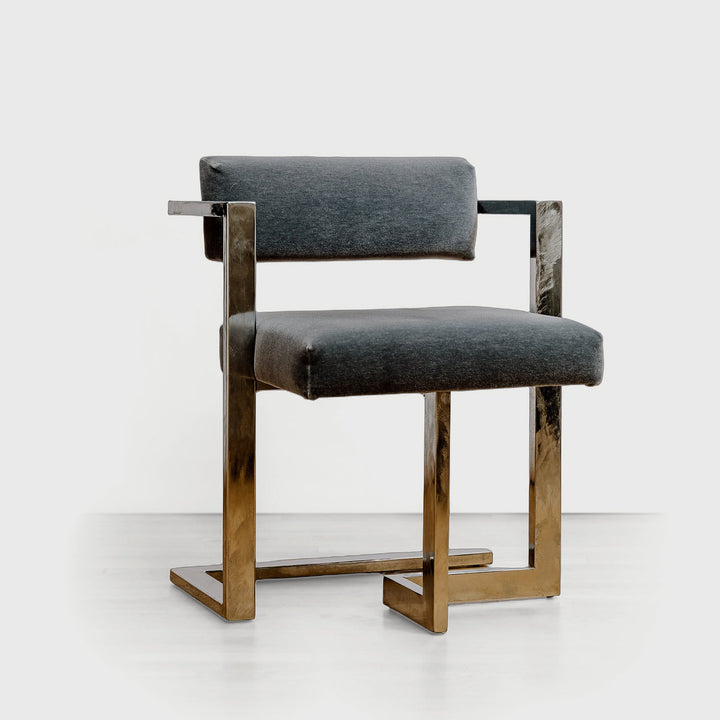 Modern chair with gray cushioned seat and backrest on a white background