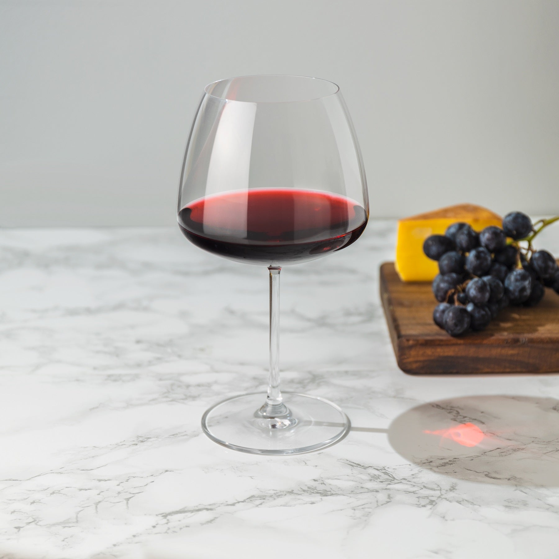 Set of two NUDE Glass Mirage red wine glasses showcasing their matching modern design.
