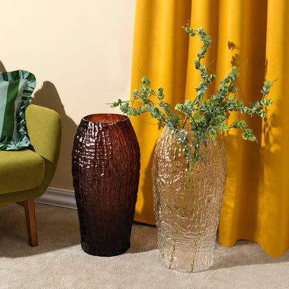 Clear and caramel amber editions of the large NUDE Glass Molten crystal vase styled together.