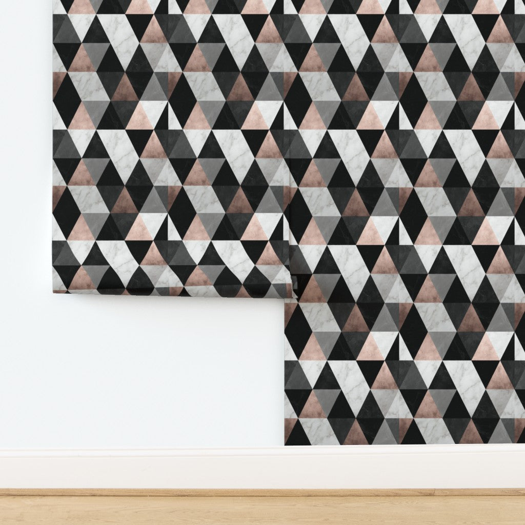 Detail of Rose Noir triangular marble mosaic wallpaper in matte non-pasted finish, showing pink and charcoal geometric tiles.
