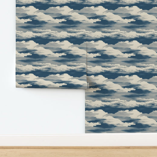 Full pattern repeat of Moonlit Clouds non-pasted wallpaper in pale blue.