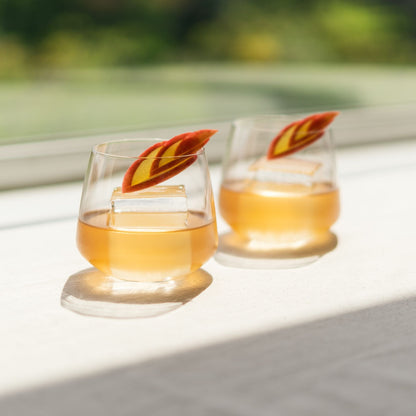 A curated modern home bar setup featuring the Mirage crystal whisky glasses and fine spirits.