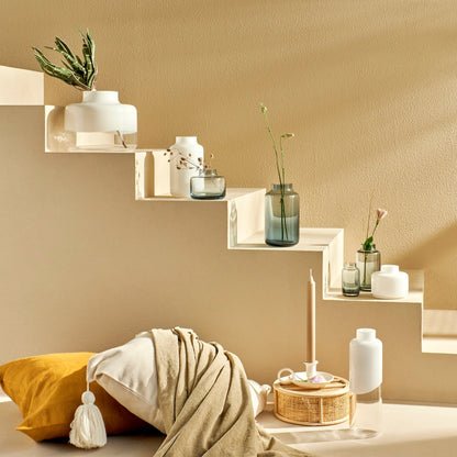 The full NUDE Magnolia and Mini Magnolia mouth-blown glass collection arranged as an elegant table centerpiece.