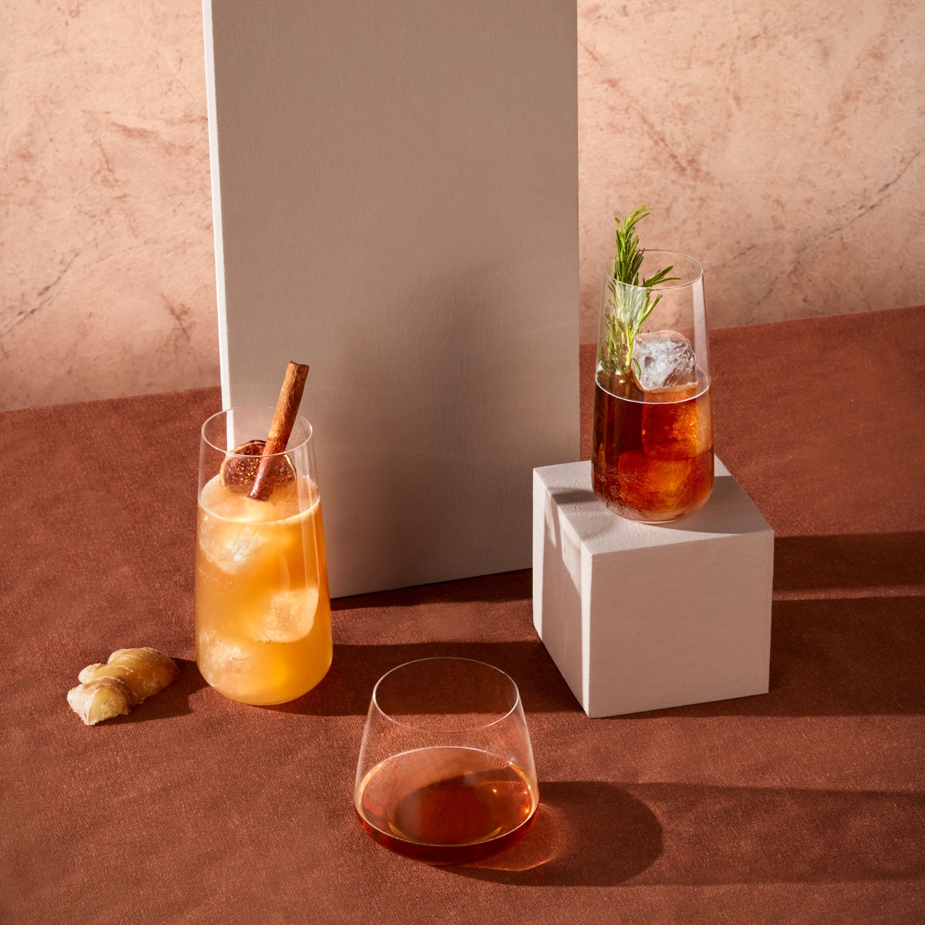A styled table setting featuring the elegant Mirage crystal highball glasses filled with a refreshing beverage.