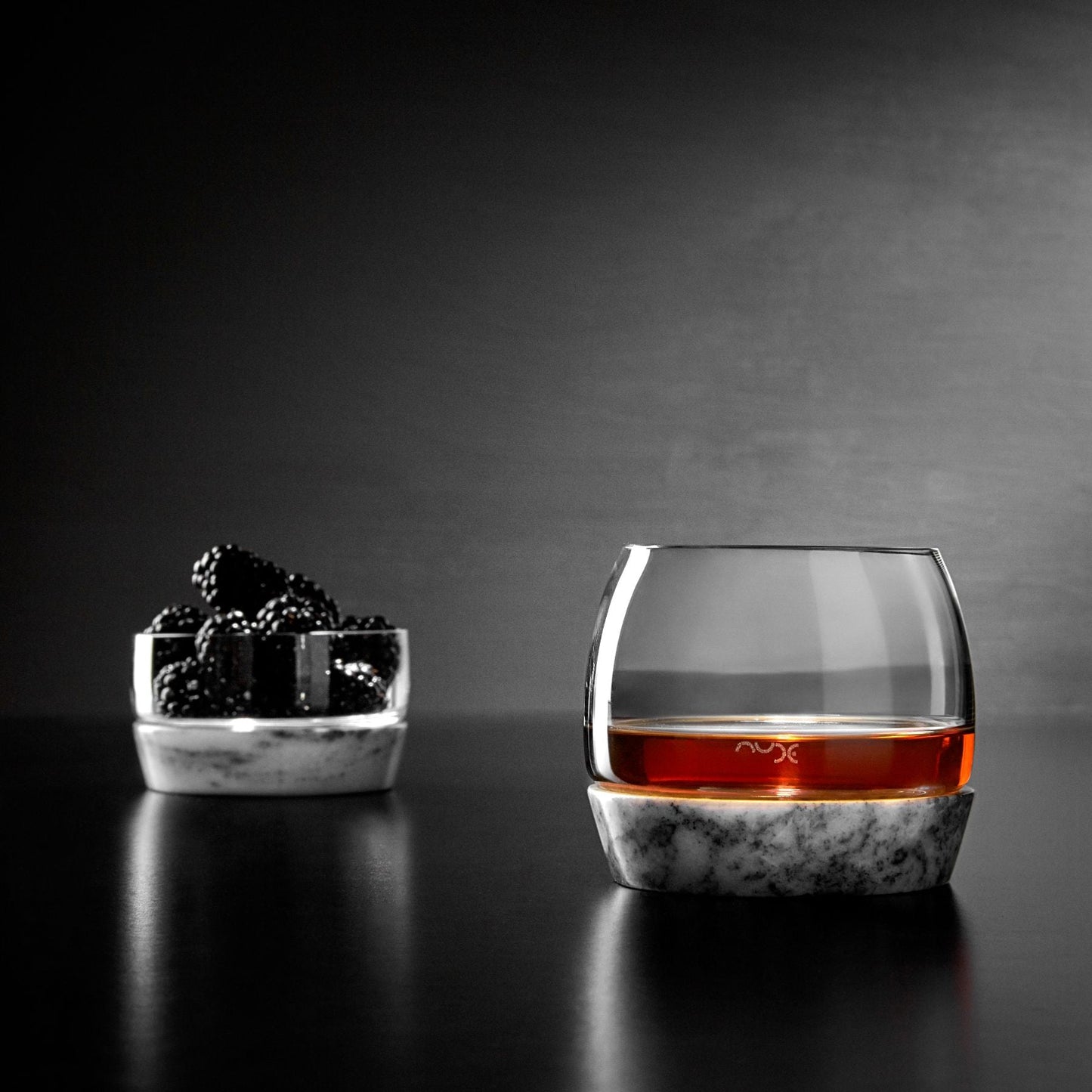 Close-up detail of the clear lead-free crystal bowl nestled securely in its heavy marble base.