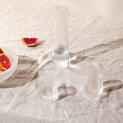 Two elegant NUDE Glass Poem crystal water glasses displayed together, highlighting their architectural form.