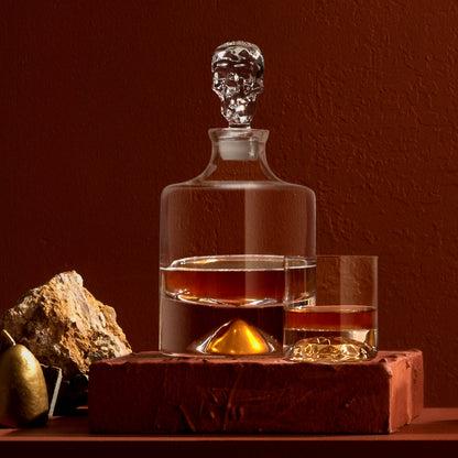 The NUDE Glass Shade crystal decanter filled with whisky on a contemporary bar surface