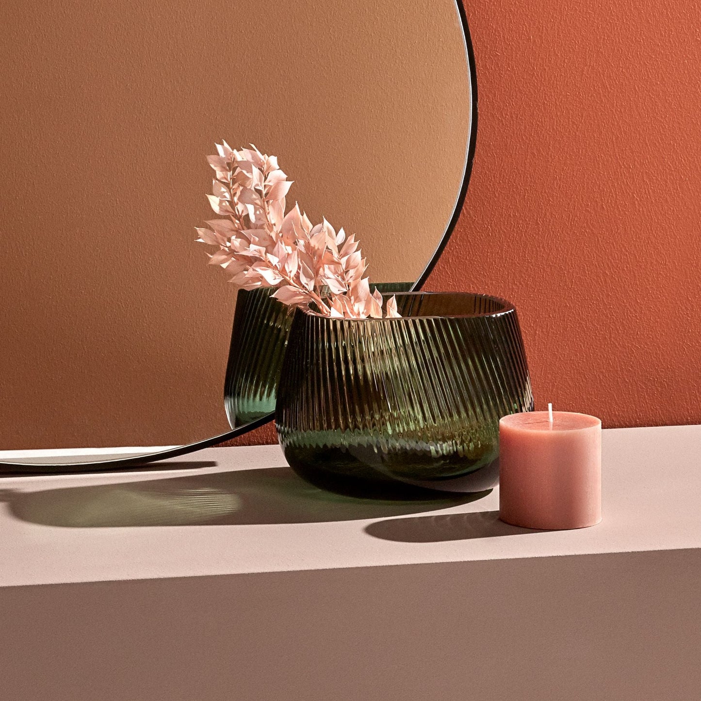 NUDE Glass Opti crystal vase placed on a modern surface, catching natural light