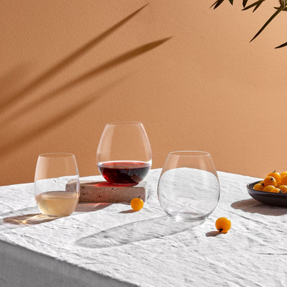 Contemporary dining arrangement showcasing the fine stem of a NUDE Pure white wine glass.