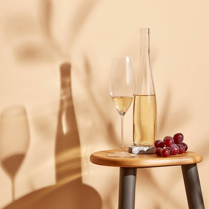 Modern tabletop presentation featuring the Stem Zero Grace sparkling wine glass in a lifestyle setting.