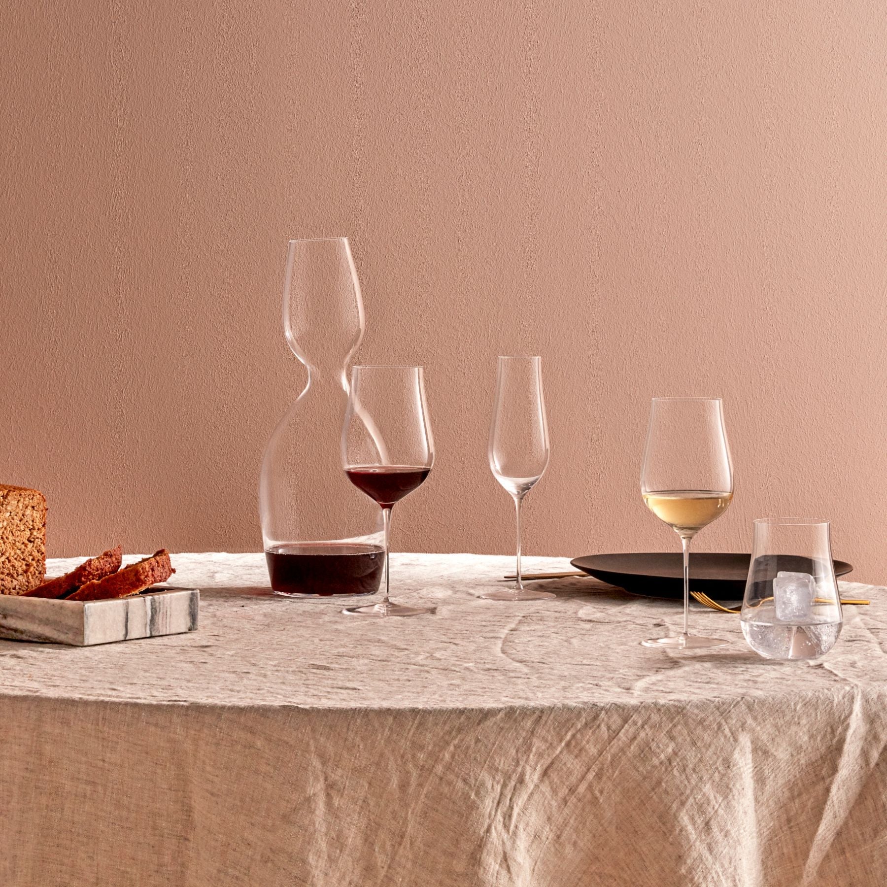 A close-up focusing on the incredibly thin rim of the handmade NUDE Ghost Zero tulip wine glass.