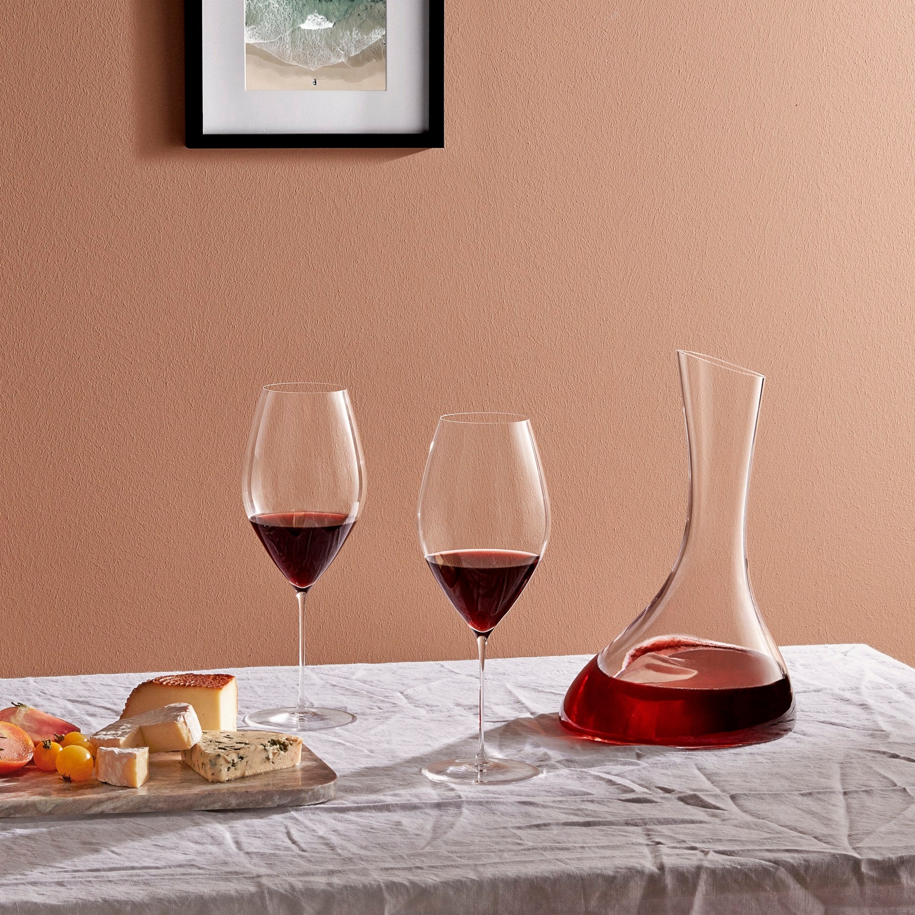 Two NUDE Glass Stem Zero Grace Red Wine Glasses side-by-side, showcasing their balanced proportions.