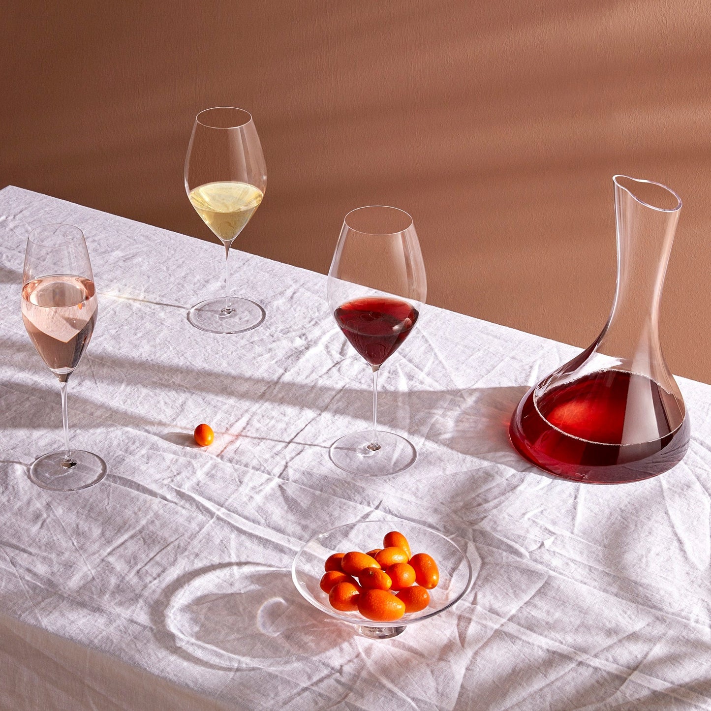 Elegant lifestyle presentation of the lead-free crystal NUDE Glass Stem Zero Grace Red Wine Glass.