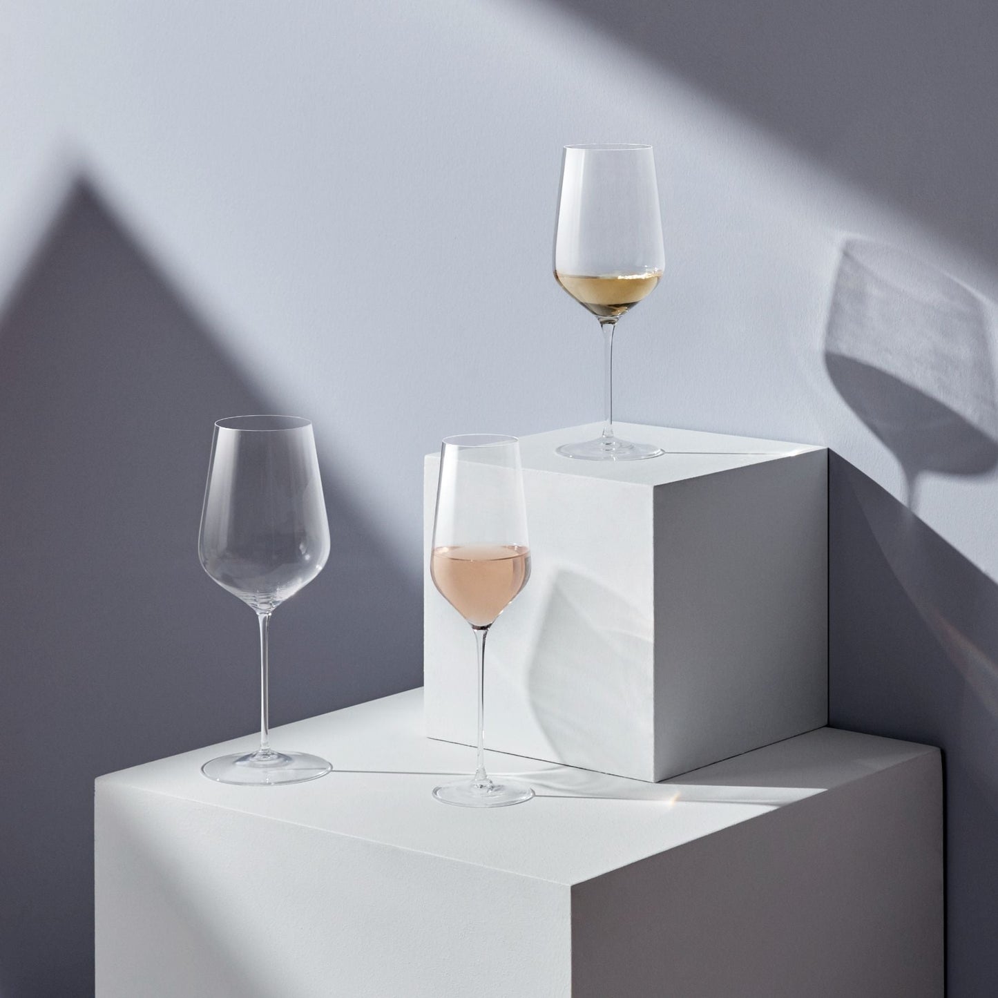 Close-up of the hand-blown bowl and thin stem of a NUDE Glass red wine glass.