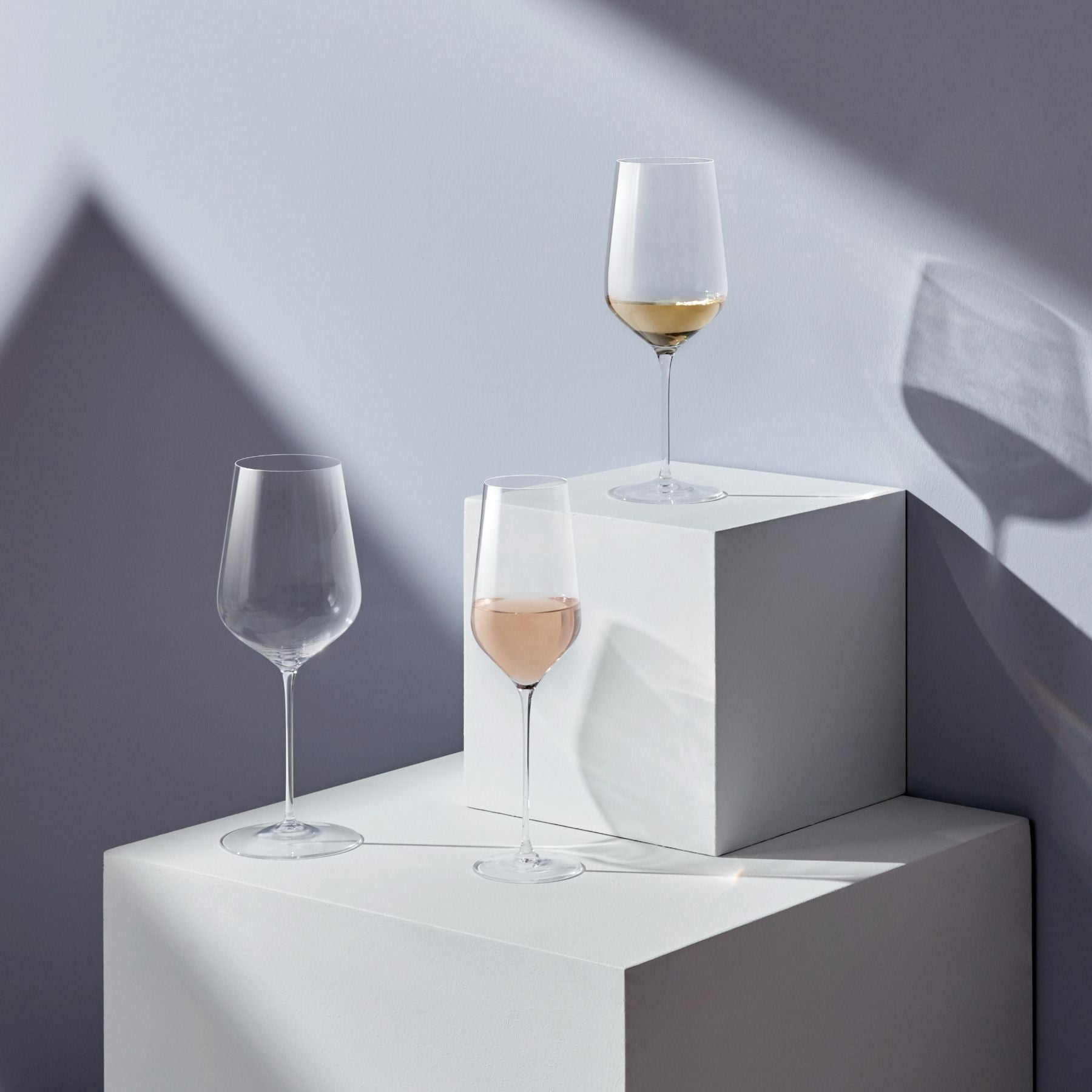 Close-up of the hand-blown bowl and thin stem of a NUDE Glass red wine glass.