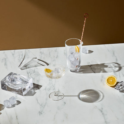 Detailed view of the sleek, architectural contours of the clear crystal spoon rest