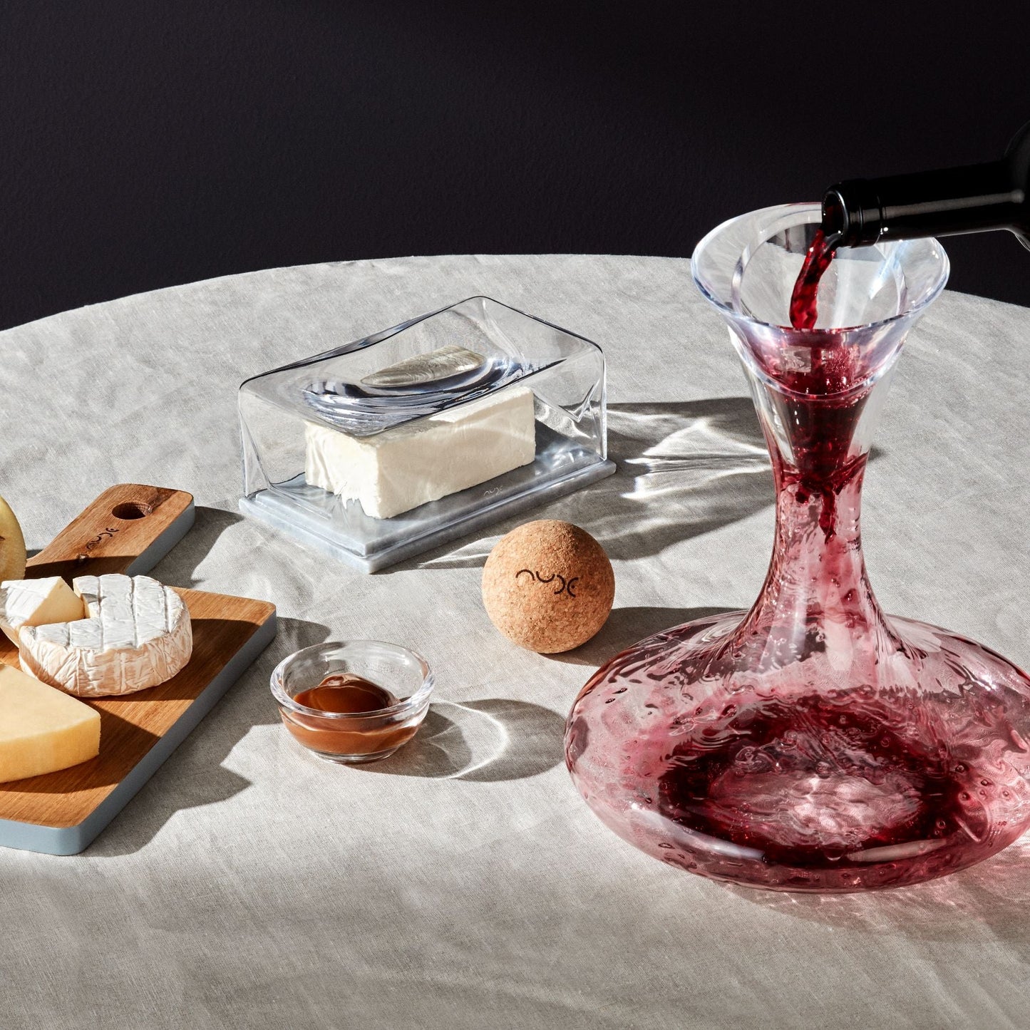 Detailed view of the clear glass spout and wide brim of the NUDE Glass Cruet Funnel.