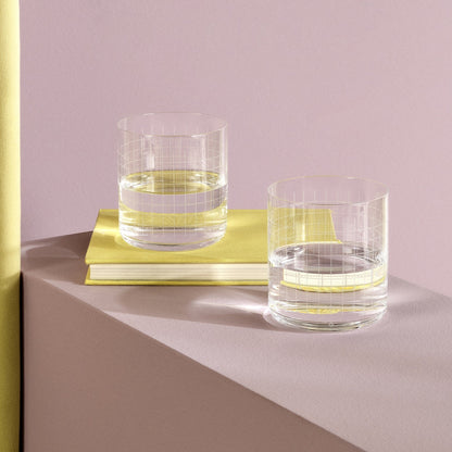Close-up of the delicate grid texture and thick base of the NUDE Glass crystal double old-fashioned tumbler.