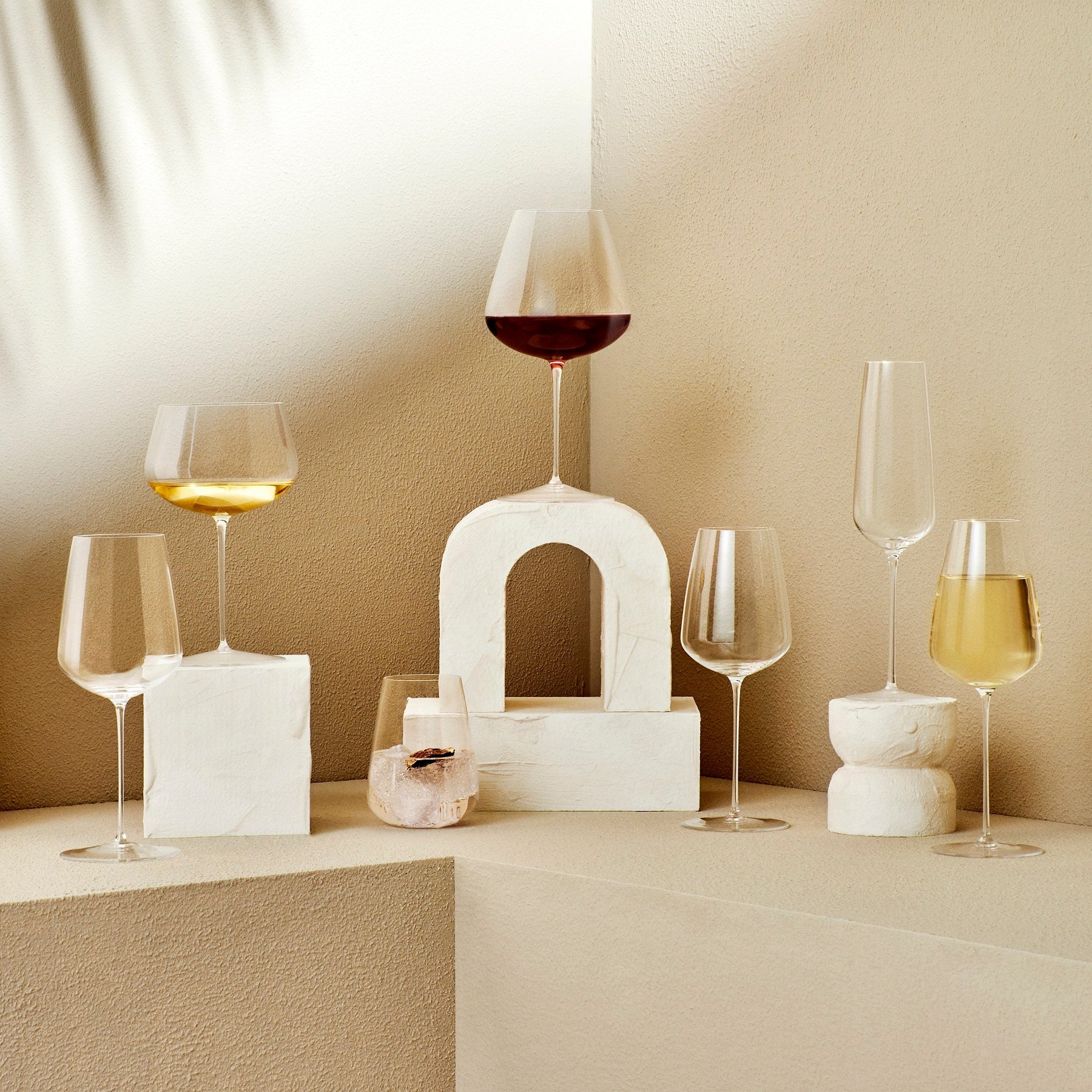 Atmospheric table setting showcasing NUDE Stem Zero glassware in a refined dining room.